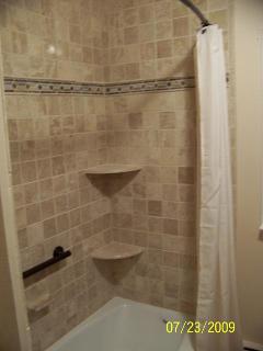 Canton Michigan Bathroom corner shelves travertine tile